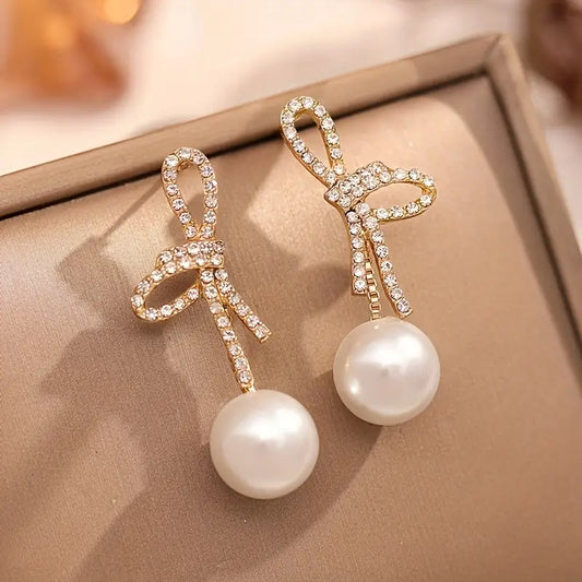 Ribbon Reverie – Elegant Bow Pearl Drop Earrings